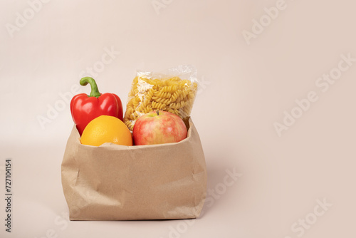 Food in a grocery bag, natural and organic selection, eco-conscious shopping