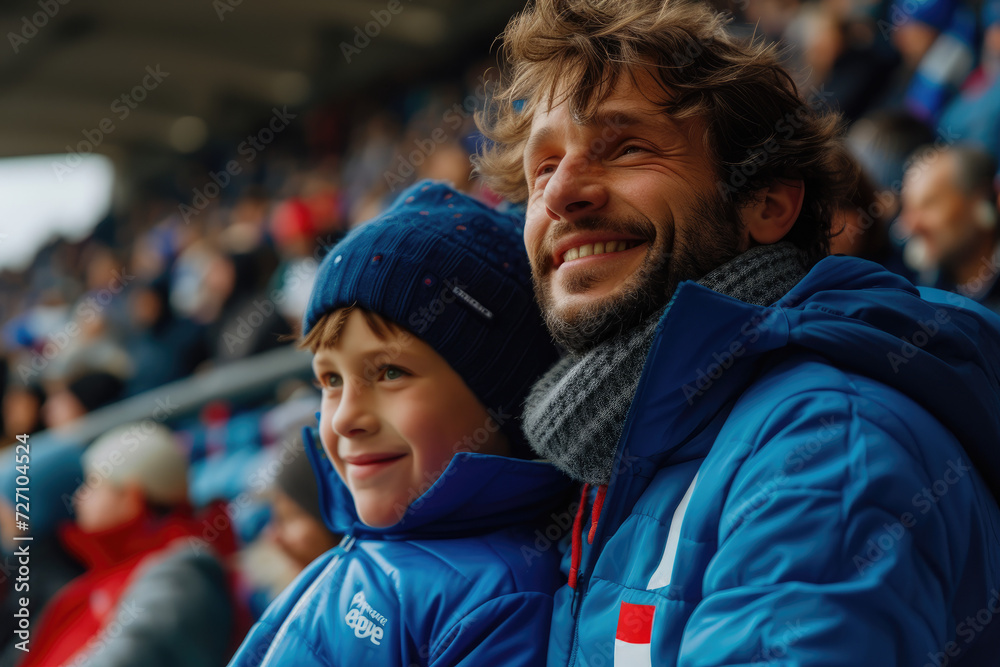 father and son in stands, filled with enthusiastic supporters football team to support national sports team