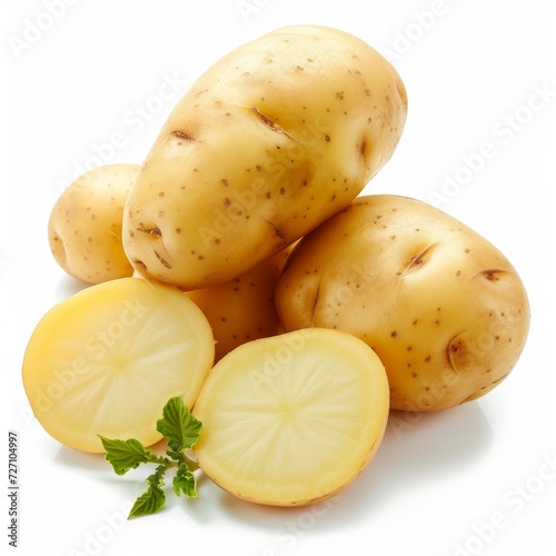 Close-up of fresh  whole and sliced yellow potatoes with sprout on a white background.