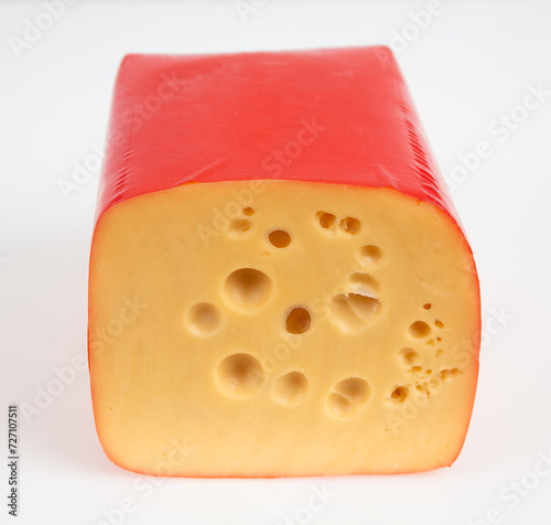 cheese in red shrink bag with cross section of the cheese shown on white 