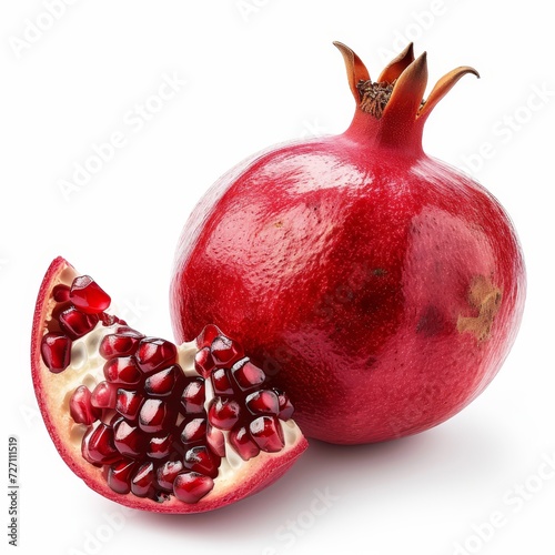 Rich red pomegranate and a section revealing juicy seeds against a white background.