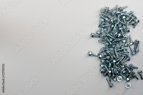 Self Tapping Sheet Metal Screws on a White Background with Copy Space