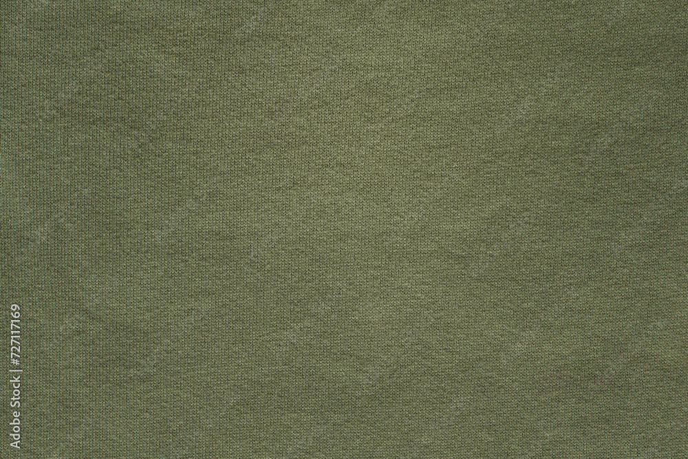 Fototapeta premium Dark green cotton fabric background with copy space