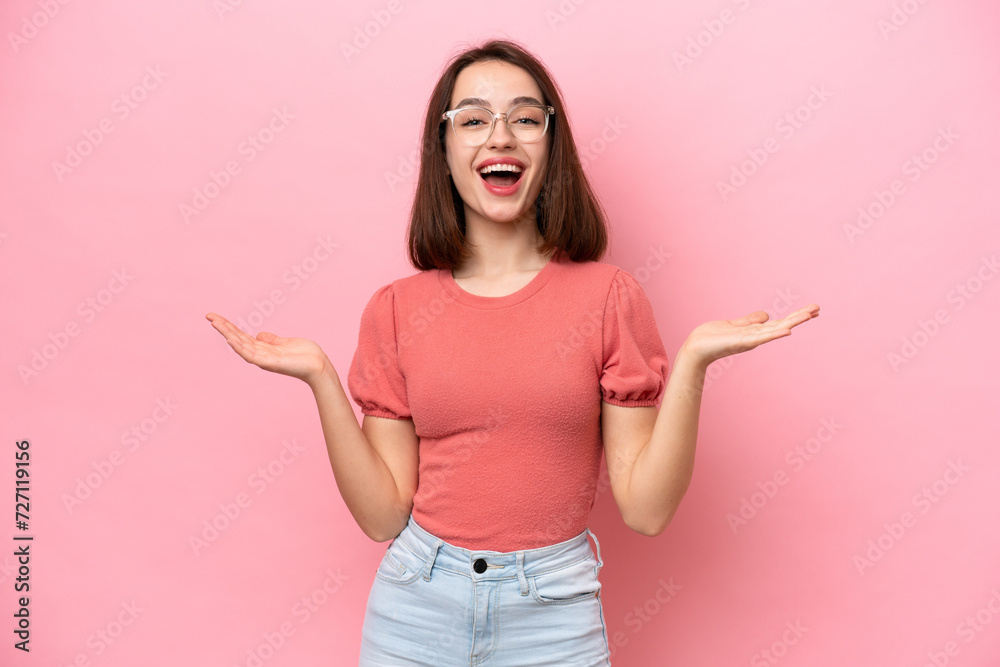 Young Ukrainian woman isolated on pink background with shocked facial expression Young Ukrainian woman isolated on pink background with shocked facial expression