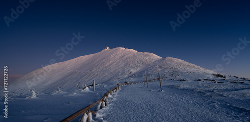 Sniezka mountain at dusk during winter in Giant mountains photo
