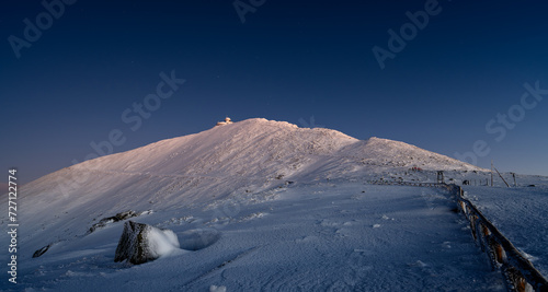 Sniezka mountain at dusk during winter in Giant mountains