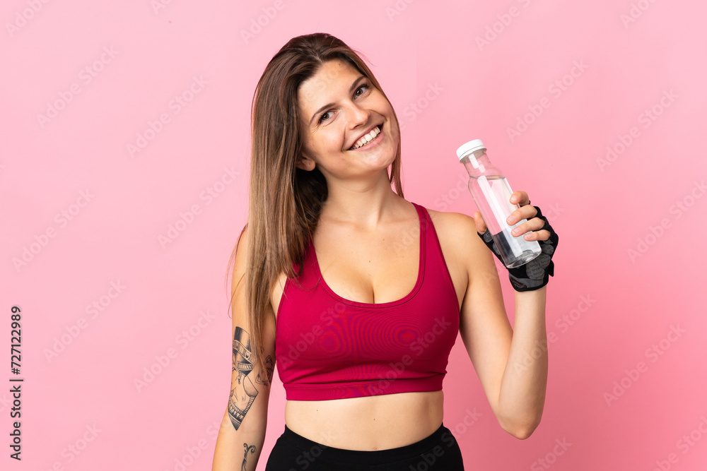 Young slovak woman isolated on pink background with sports water bottle Young slovak woman isolated on pink background with sports water bottle