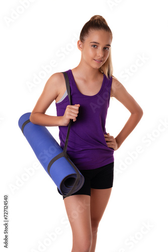 young beautiful slim teen girl with yoga mat isolated on white background