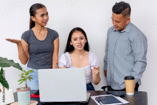 Two upset women defend their project and voice out their frustrations to an overbearing and obstinate supervisor or superior.