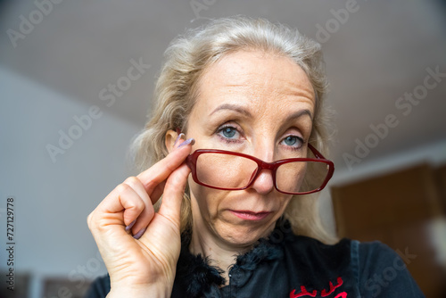 Portrait smart attractive business woman with glasses and happy expression photo