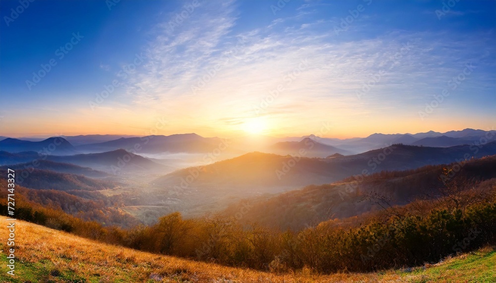 panoramic view of the sunrise in the mountains valley