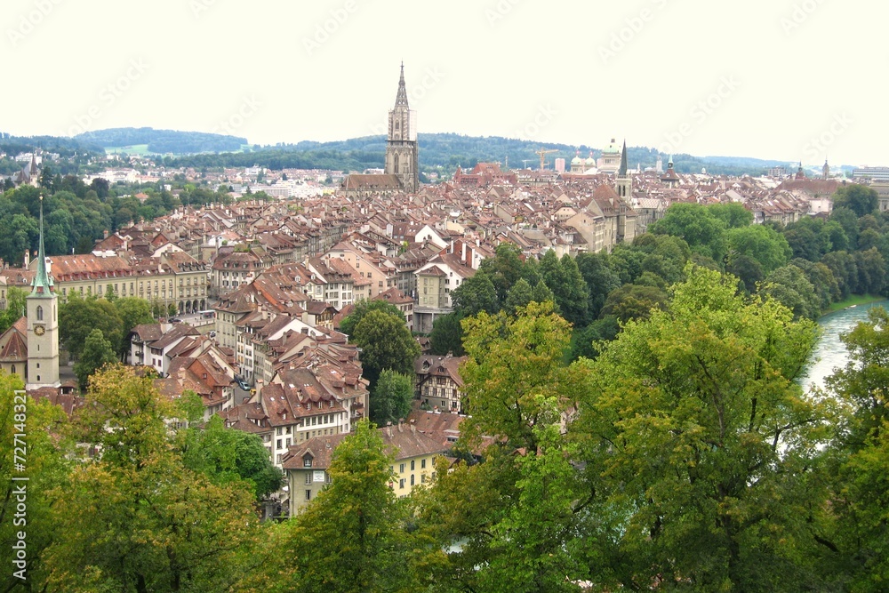 Panoramic view of river Aare and rooftops houses at old historical center town in Bern, Switzerland.