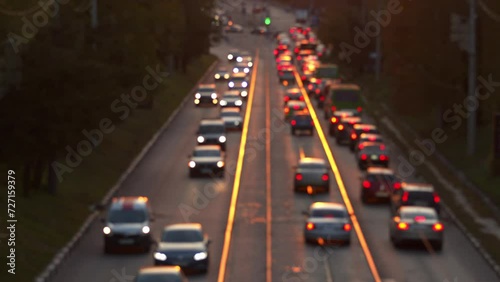 Kharkiv Kharkov region, Ukraine - 21.10.2021: Ukraine Kharkov late afternoon busy city street traffic many blurred cars against the sunset stuck in traffic jam view from above 50 FPS. High quality 4k