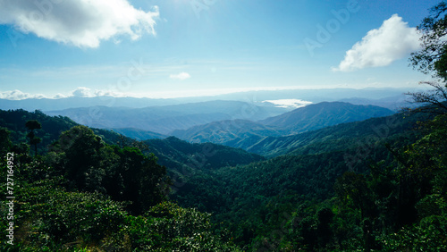 Beautiful sunshine at misty morning mountains of Thailand. Rainforest ecosystem and healthy environment concept background, Texture of green tree forest view from above.