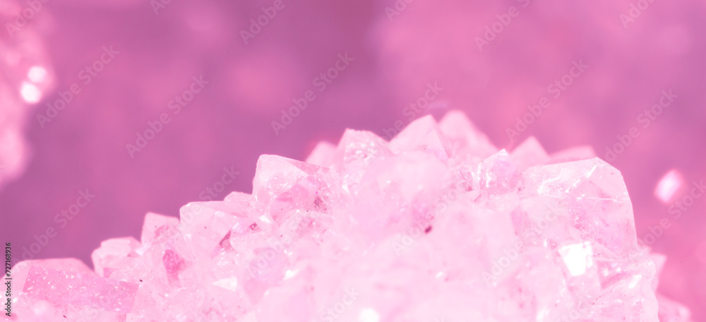 Amethyst pink crystals. Gems. Mineral crystals in the natural environment. Texture of precious and semiprecious stones. Seamless background with copy space colored shiny surface of precious stones. Amethyst pink crystals. Gems. Mineral crystals in the natural environment. Texture of precious and semiprecious stones. Seamless background with copy space colored shiny surface of precious stones.
