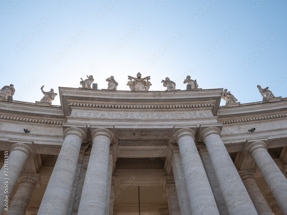Statues of saints and apostles on colonnade of St. Peter's basilica, Vatican city, Italy. Horizontal view Statues of saints and apostles on colonnade of St. Peter's basilica, Vatican city, Italy. Horizontal view
