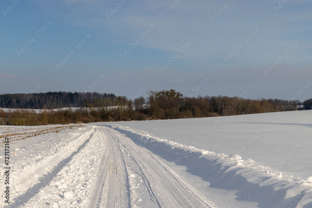 winter road after snowfall in sunny weather winter road after snowfall in sunny weather