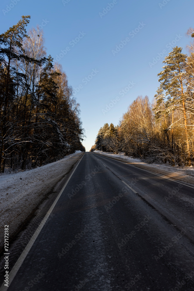 a slippery and dangerous road covered with snow and ice a slippery and dangerous road covered with snow and ice