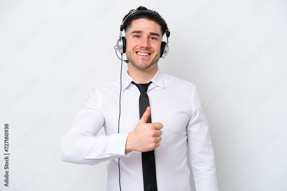 Telemarketer caucasian man isolated on white background giving a thumbs up gesture