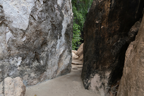 Pathway in the rock. At Wat Tham Khao Bot Tample Wangchan Rayong Thailand. The path between the rocks.