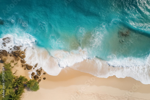 Top view of Tropical island palm tree beach, Overhead view, Aerial shot of a beach with nice sand, blue turquoise water.