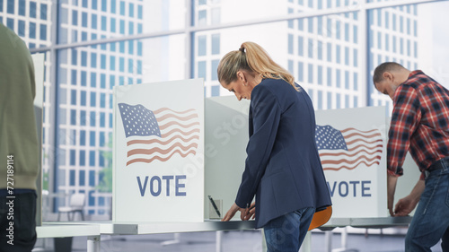 Bild auf Leinwand Businesswoman Filling Out a Ballot in a Voting Booth on the Day of National Elections in the United States