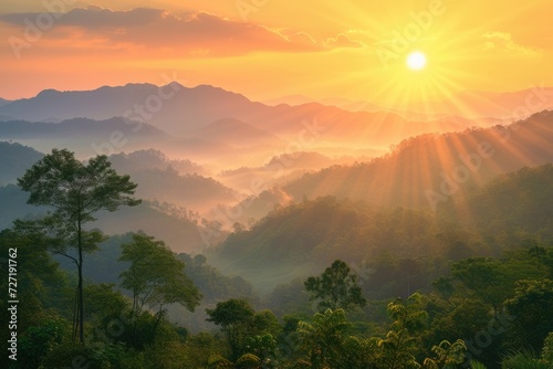 Beautiful sunrise over the mountain range at the west of thailand © darshika