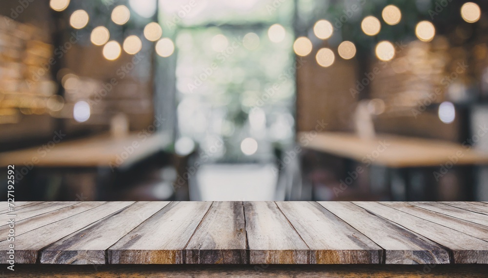 empty old wood table top and blurred bokeh cafe and coffee shop ...