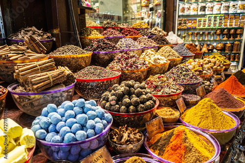 Fototapeta Naklejka Na Ścianę i Meble -  A counter with seasonings and spices in the ancient Arab spice market. A large number of colors and flavors.