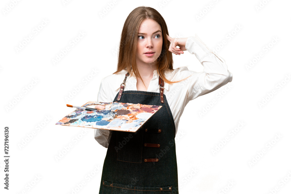 Young artist woman holding a palette over isolated chroma key background having doubts and thinking Young artist woman holding a palette over isolated chroma key background having doubts and thinking