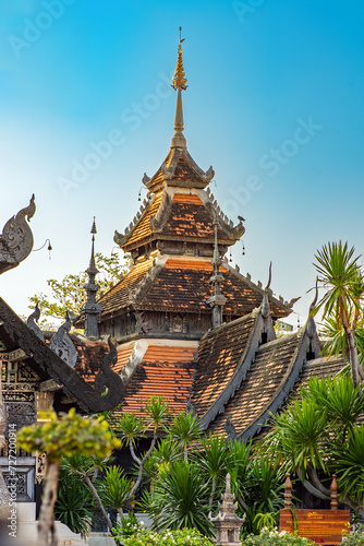 The Viharn Chaturmuk-Burapachaan in the Wat Chedi Luang. The construction is mostly teak with an impressive tiered roof tower in the middle  and contains an image of a famous monk in wax 