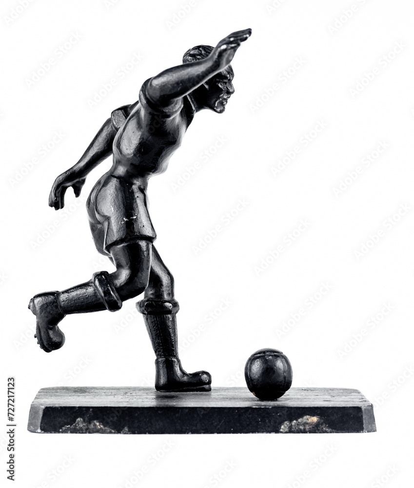 A purchased (consumer) figure of a football player made of cast iron in close-up on a white background