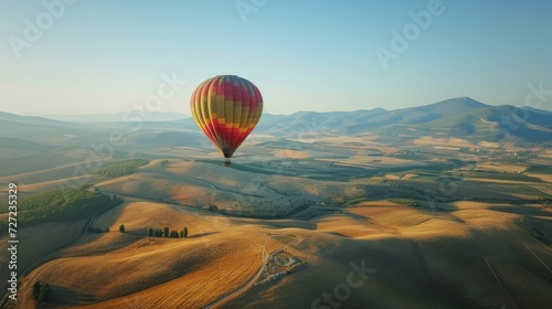 Hot Air Balloon Soaring Above a Vibrant Green Field, Summer Day