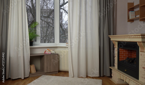 Interior with fireplace and view from the window.