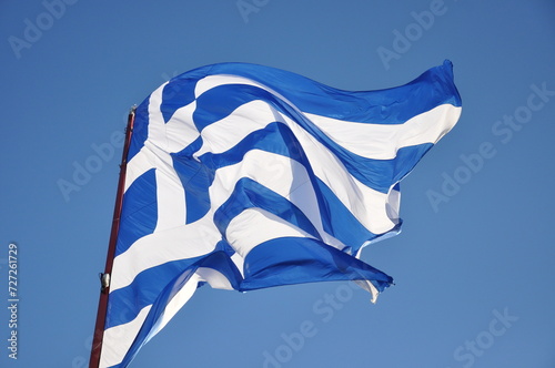 The Greek flag in a port of a Greek island during events