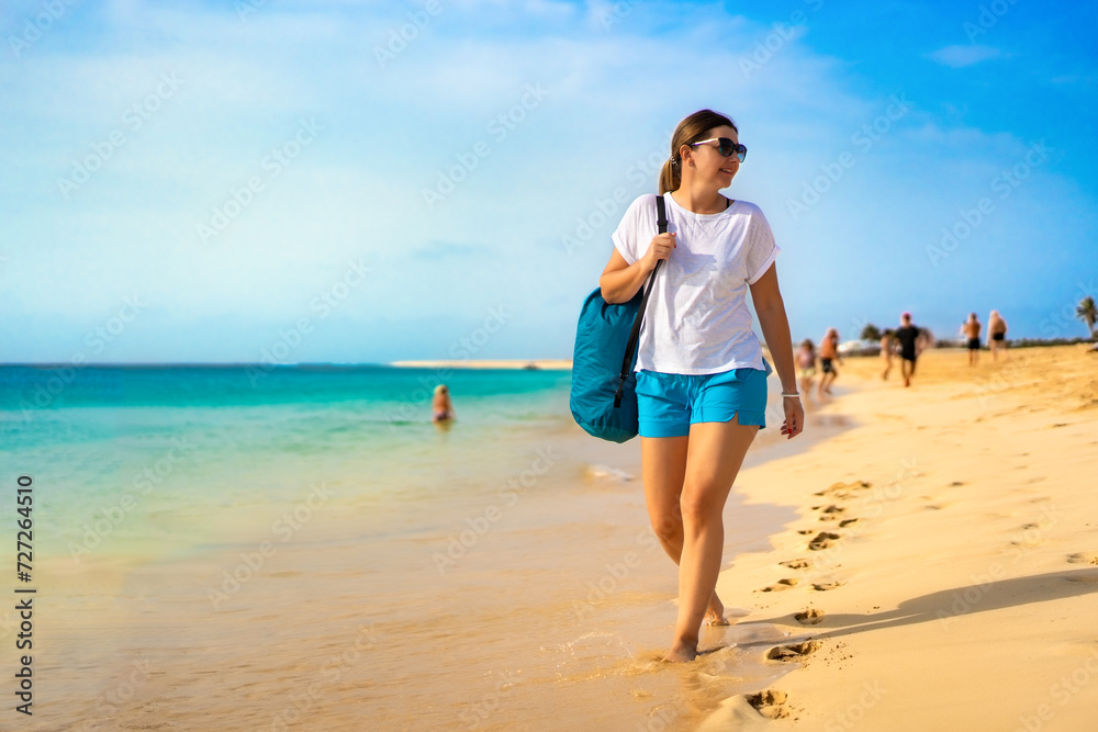 Beautiful woman walking on sunny beach Santa Maria, Sal Island, Cape Verde
Beautiful woman walking on sunny beach Santa Maria, Sal Island, Cape Verde