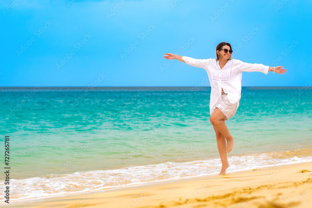 Beautiful woman walking on sunny beach Santa Maria, Sal Island, Cape Verde
Beautiful woman walking on sunny beach Santa Maria, Sal Island, Cape Verde