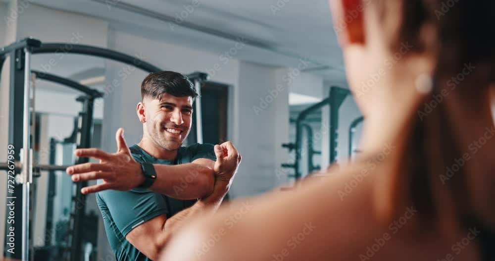 Coach, gym class and man stretching for fitness, bodybuilding or exercise for sports development. Training, warm up and personal trainer teaching community, team activity or start workout routine Coach, gym class and man stretching for fitness, bodybuilding or exercise for sports development. Training, warm up and personal trainer teaching community, team activity or start workout routine