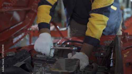 Professional mechanic working on vehicles in car service center engine specialist Car repair work in a car service center.