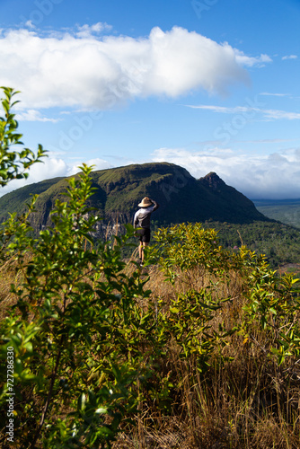 man with hat with partial view of Kurun tepui from top of Kurawaina (Kuravaina). Canaima National Park, Venezuela