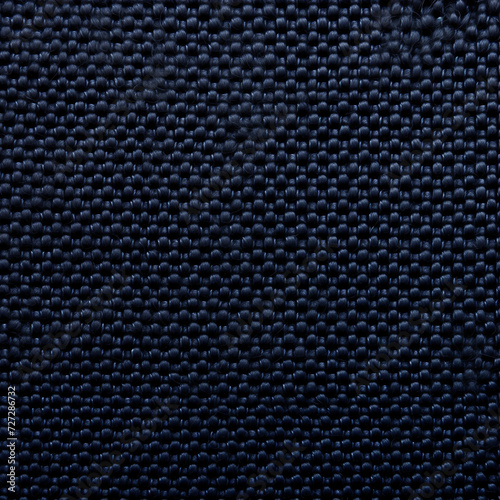 Close-up texture of a dark blue braided fabric with a detailed weave pattern