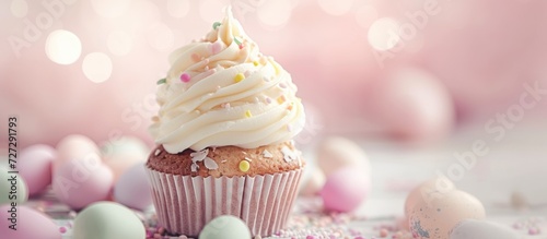 Easter-themed cupcake with soft colors and blurry background. photo