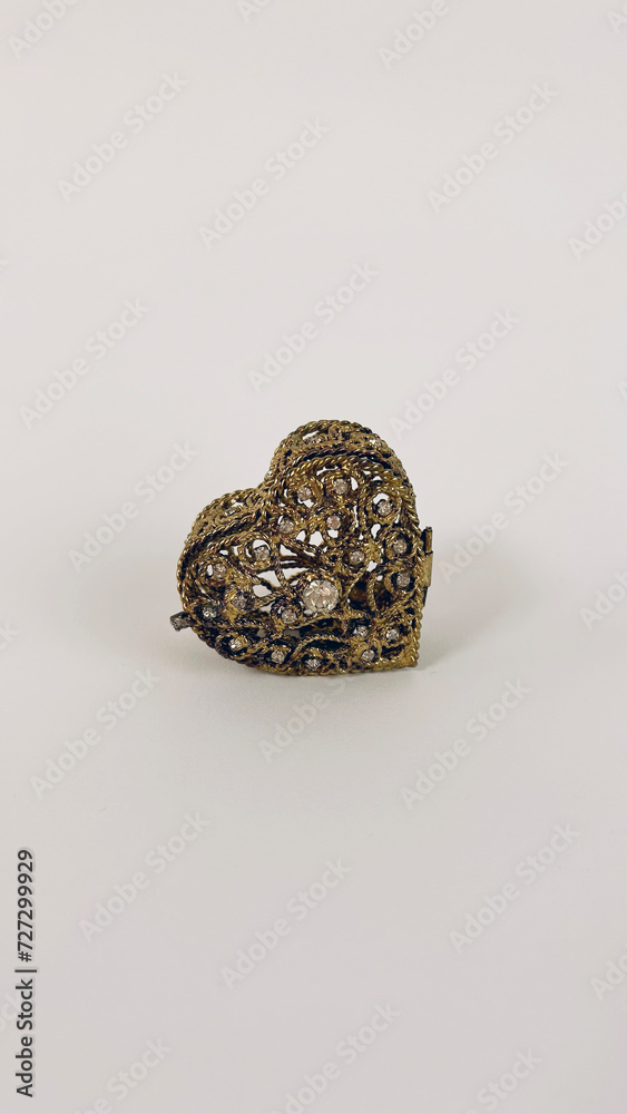 an antique casket in the shape of a heart
