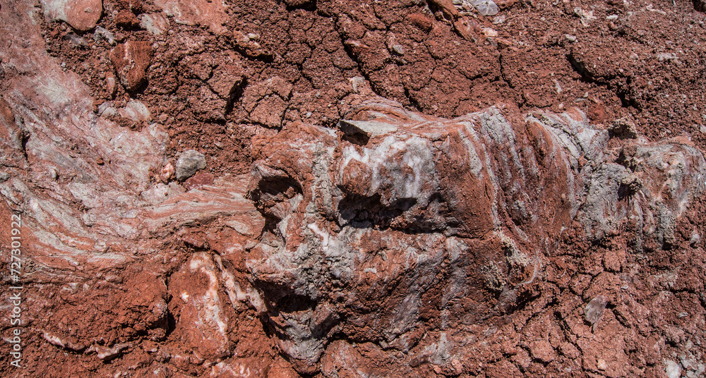 Fototapeta premium Red stones, blue sky, green water