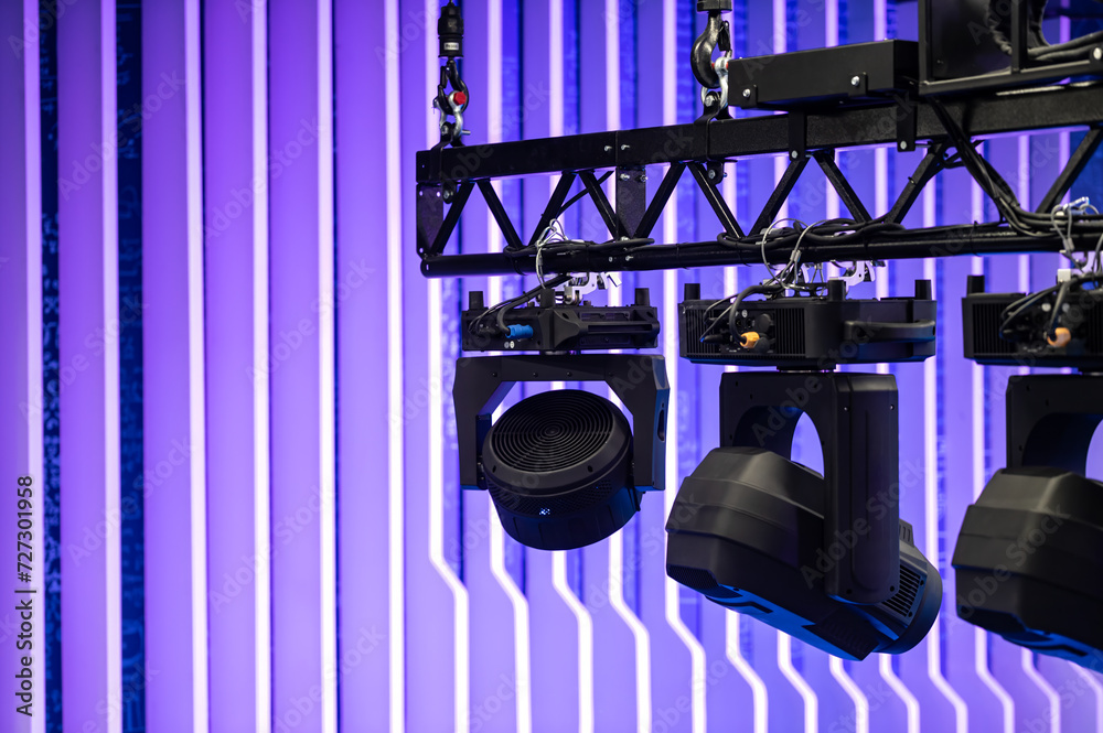 modern lighting equipment on a suspended truss. professional lighting equipment led projector suspended on an aluminum truss