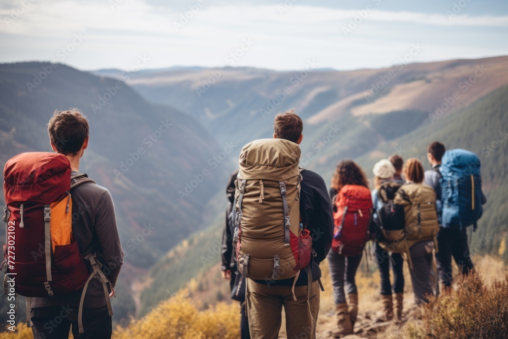 Group of men and women hikers with backpacks 