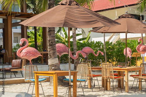 Visit a popular pink flamingo concept restaurant in a cafe next to the sea, Sue Flamingo, Ao Yon Beach, Phuket Thailand photo