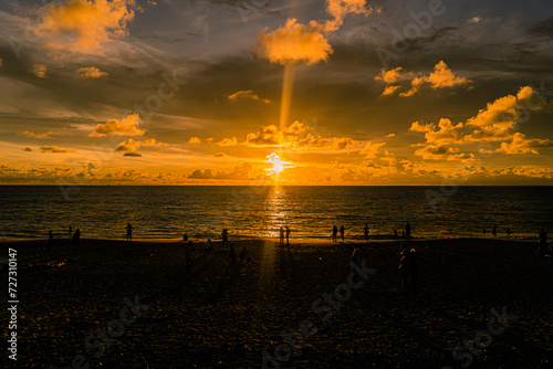 scene romantic sunset at Karon beach. abstract nature background..Sunset with bright color light rays and other atmospheric effects..Gradient color.cloudscape background in Phuket Thailand.