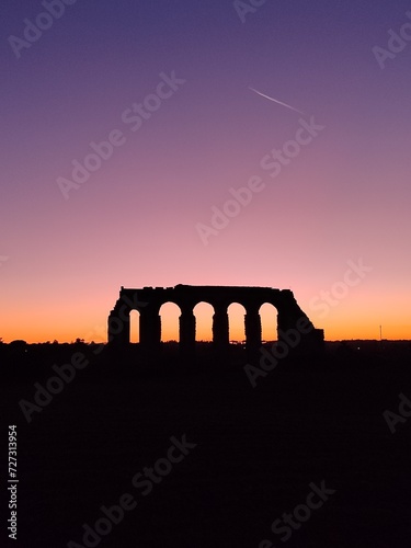roman aqueduct at sunset