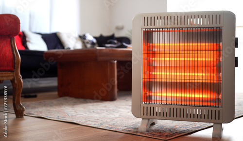 A warm room, in the cold season, an electric heater creates comfort in the house, warming it